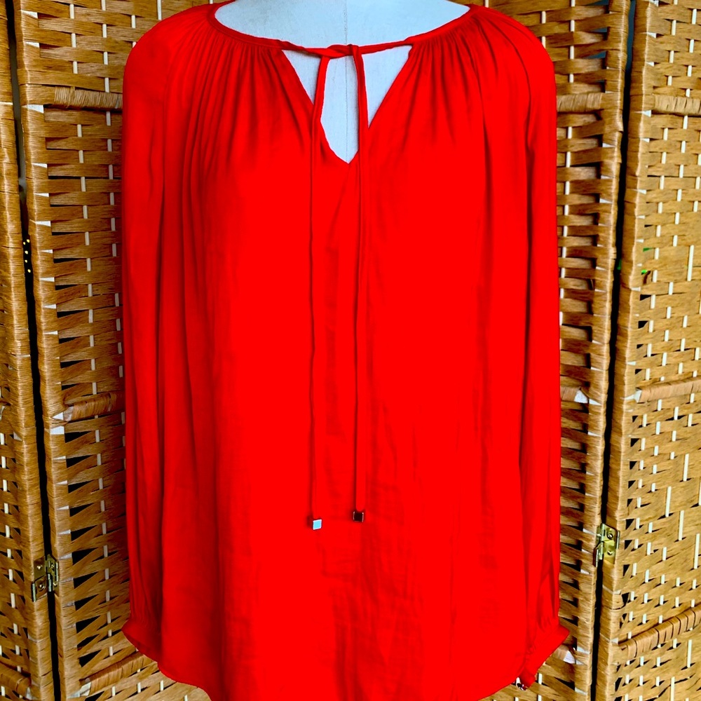 Jennifer Lopez red blouse